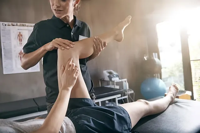 Sports therapy session on an athlete's leg